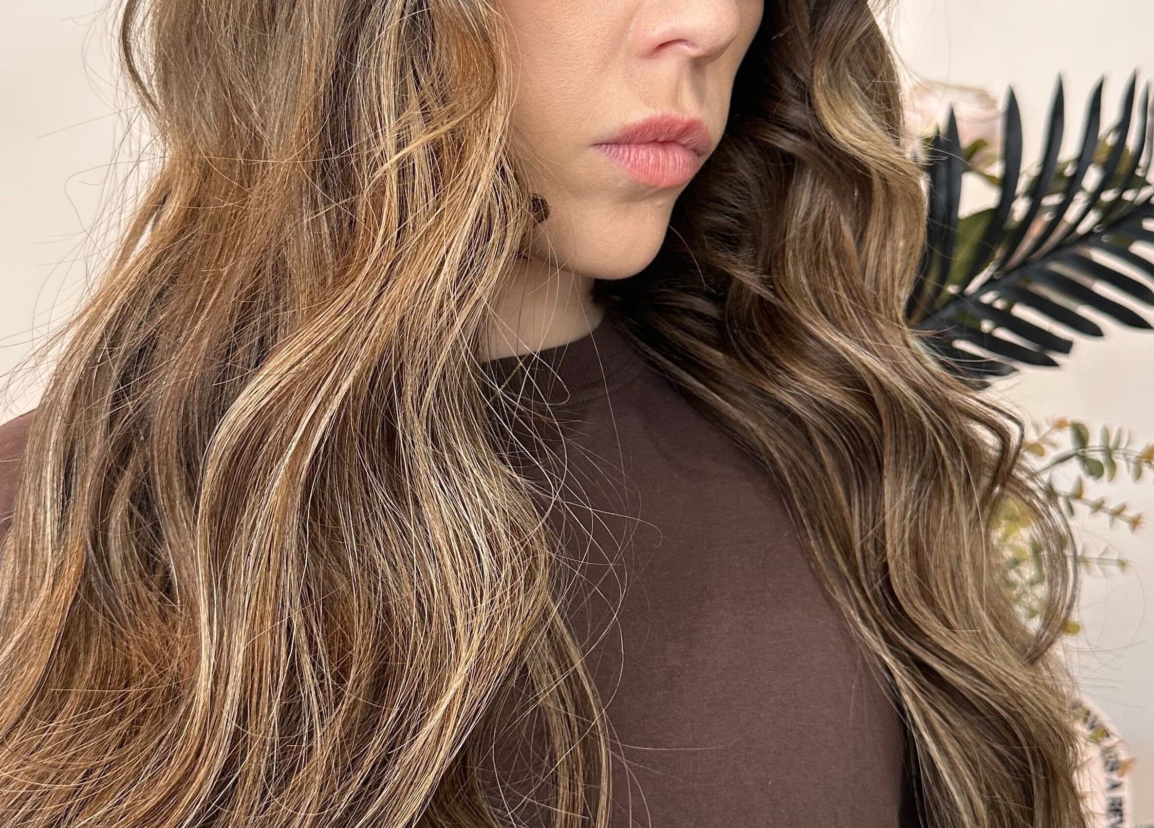 Lush wavy hairstyle at Runway, Tamworth, New South Wales, AU, showcasing intricate hair coloring.