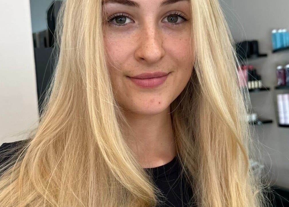 Blonde woman at Runway, Tamworth, New South Wales, AU, showcasing sleek hair styling services.