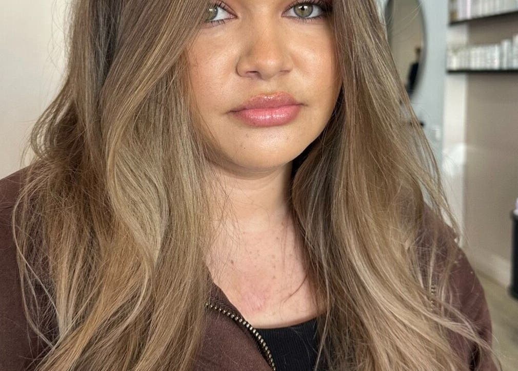 Woman with styled hair at Runway, Tamworth, New South Wales, AU, showcasing modern beauty services.