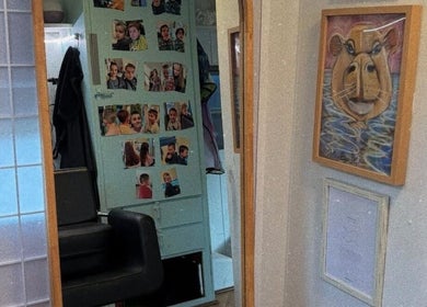 Artistic decor at Hopes 4 Hair salon in Melbourne, Victoria, AU featuring family photos and unique artwork.