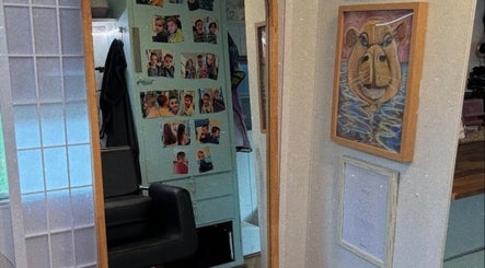 Artistic decor at Hopes 4 Hair salon in Melbourne, Victoria, AU featuring family photos and unique artwork.