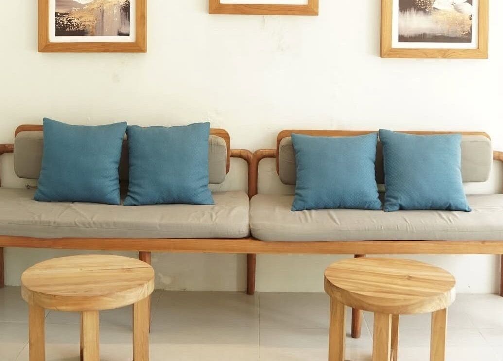 Elegant lounge at KU Salon & Spa, Nusa Tenggara Barat with cozy seating and decor.