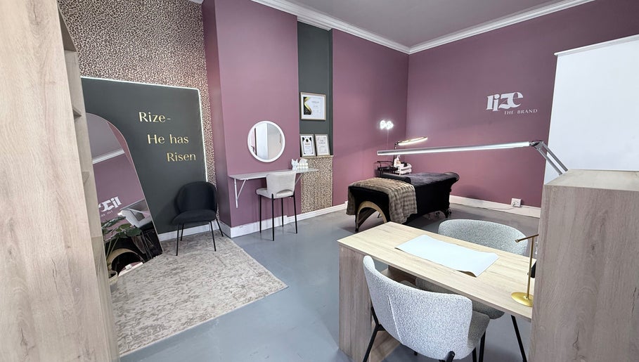 Elegant salon room at RIZE - The Brand in Bloemfontein, Free State, ZA with modern decor and treatment table.