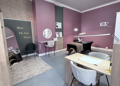 Elegant salon room at RIZE - The Brand in Bloemfontein, Free State, ZA with modern decor and treatment table.