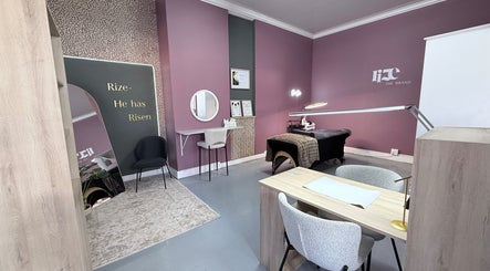 Elegant salon room at RIZE - The Brand in Bloemfontein, Free State, ZA with modern decor and treatment table.