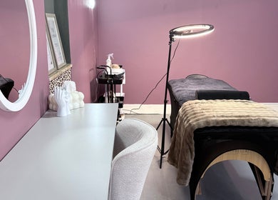 Cozy treatment room at RIZE - The Brand, Bloemfontein, Free State, ZA with massage table and soft lighting.