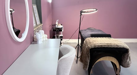 Cozy treatment room at RIZE - The Brand, Bloemfontein, Free State, ZA with massage table and soft lighting.