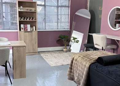 Elegant beauty room at RIZE - The Brand in Bloemfontein, Free State, ZA, featuring nail and massage areas.