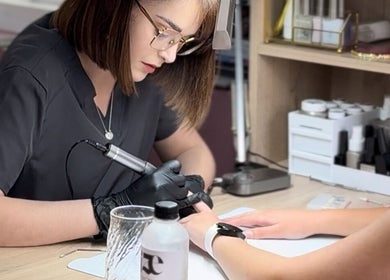 Nail technician performing manicure at RIZE - The Brand, Bloemfontein, Free State, ZA.