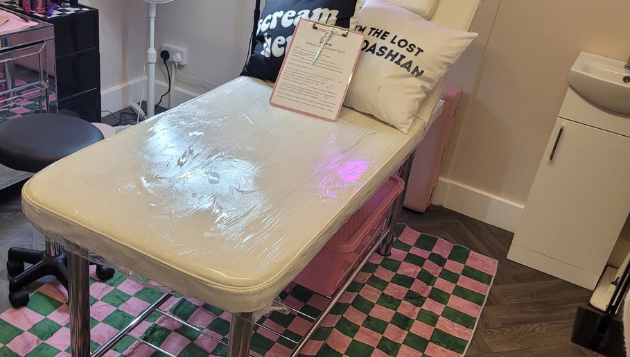 Comfortable treatment bed at Willow Ink in York, England, GB, with inviting pillows and stylish decor.