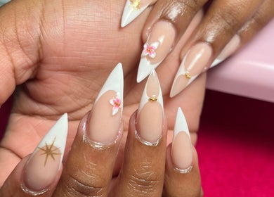 Elegant nail art with floral accents at Royal Nails, Soweto, Gauteng, ZA, showcasing intricate designs.