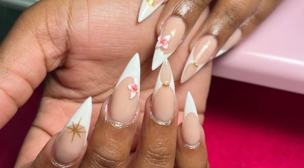 Elegant nail art with floral accents at Royal Nails, Soweto, Gauteng, ZA, showcasing intricate designs.