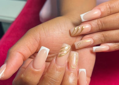 Elegant nail art with gold designs at Royal Nails, Soweto, Gauteng, ZA. Perfect for stylish manicures.