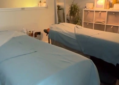 Cozy therapy room at Irina Zukh at Alprem in Waterford, County Waterford, IE, features two massage tables.