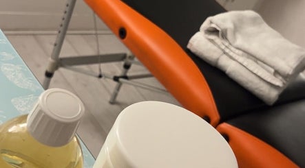 Massage table with towels and oils at ActiveRevive, Sheffield, England, GB.
