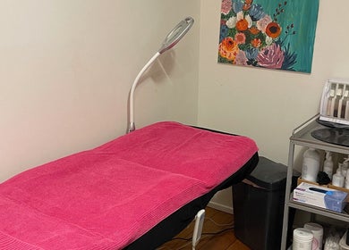Velvet Waxing and Beauty treatment room with pink cover in Melbourne, Victoria, AU, showcasing a serene setup.
