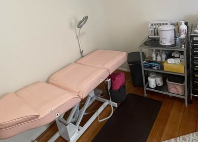 Treatment room at Velvet Waxing and Beauty, Melbourne, Victoria, AU with a waxing bed and supplies.