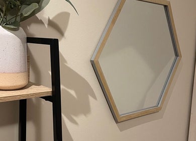 Stylish hexagon mirror and vase at Velvet Waxing and Beauty, Melbourne, Victoria, AU.