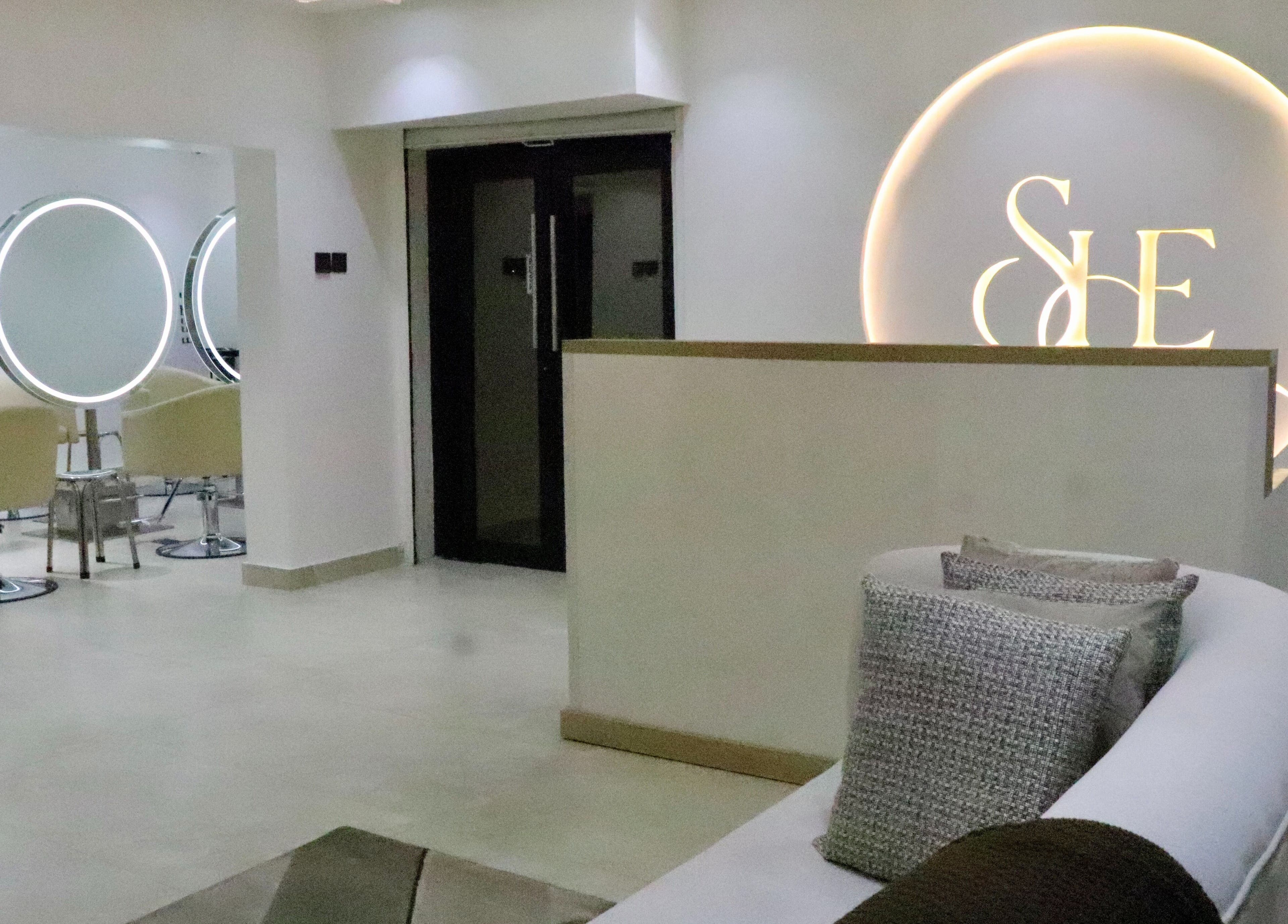 Chic interior of SHE Beauty Studio, Lagos; cozy seating and styling areas at Lagos, Lagos, NG.