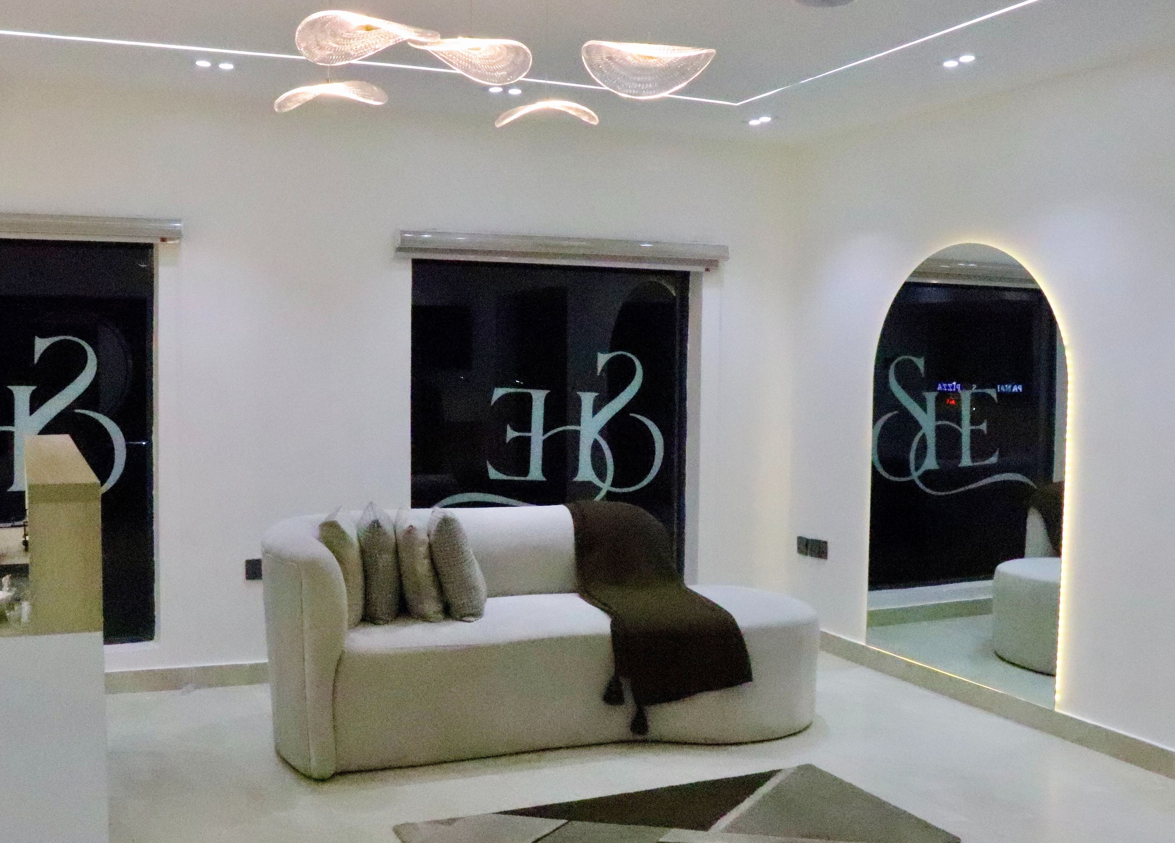 Modern elegant lounge area at SHE Beauty Studio, Lagos with plush seating, serene decor. Lagos, Lagos, NG.