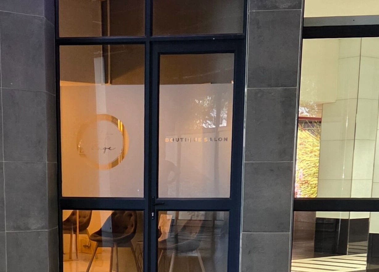 Chic salon entrance of White Sage (Pty) Ltd in Cape Town, Western Cape, ZA showcases modern design.