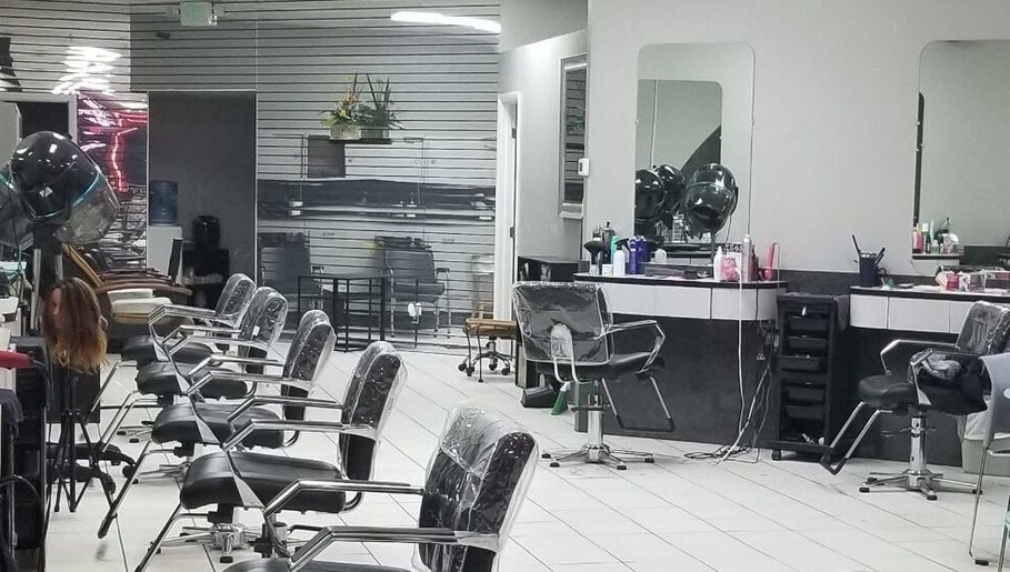 Modern interior of Hair Design From Ashley in Glen Burnie, Maryland, US, showing stylish salon stations.
