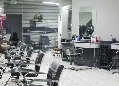 Modern interior of Hair Design From Ashley in Glen Burnie, Maryland, US, showing stylish salon stations.