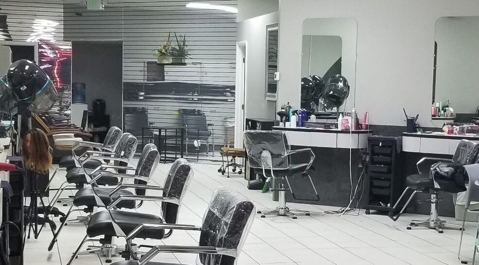 Modern interior of Hair Design From Ashley in Glen Burnie, Maryland, US, showing stylish salon stations.