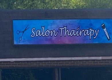 Salon Thairapy's vibrant sign, boosting visibility for Hair Design From Ashley in Glen Burnie, Maryland, US.
