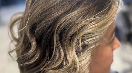 Stylish blonde waves hairstyle at Hair Design From Ashley, Glen Burnie, Maryland, US.