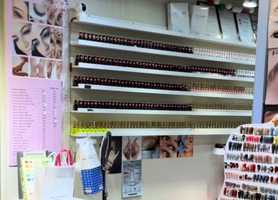 Sakura Nails display in Singapore, SG, showcasing a vibrant array of nail polish and design options.