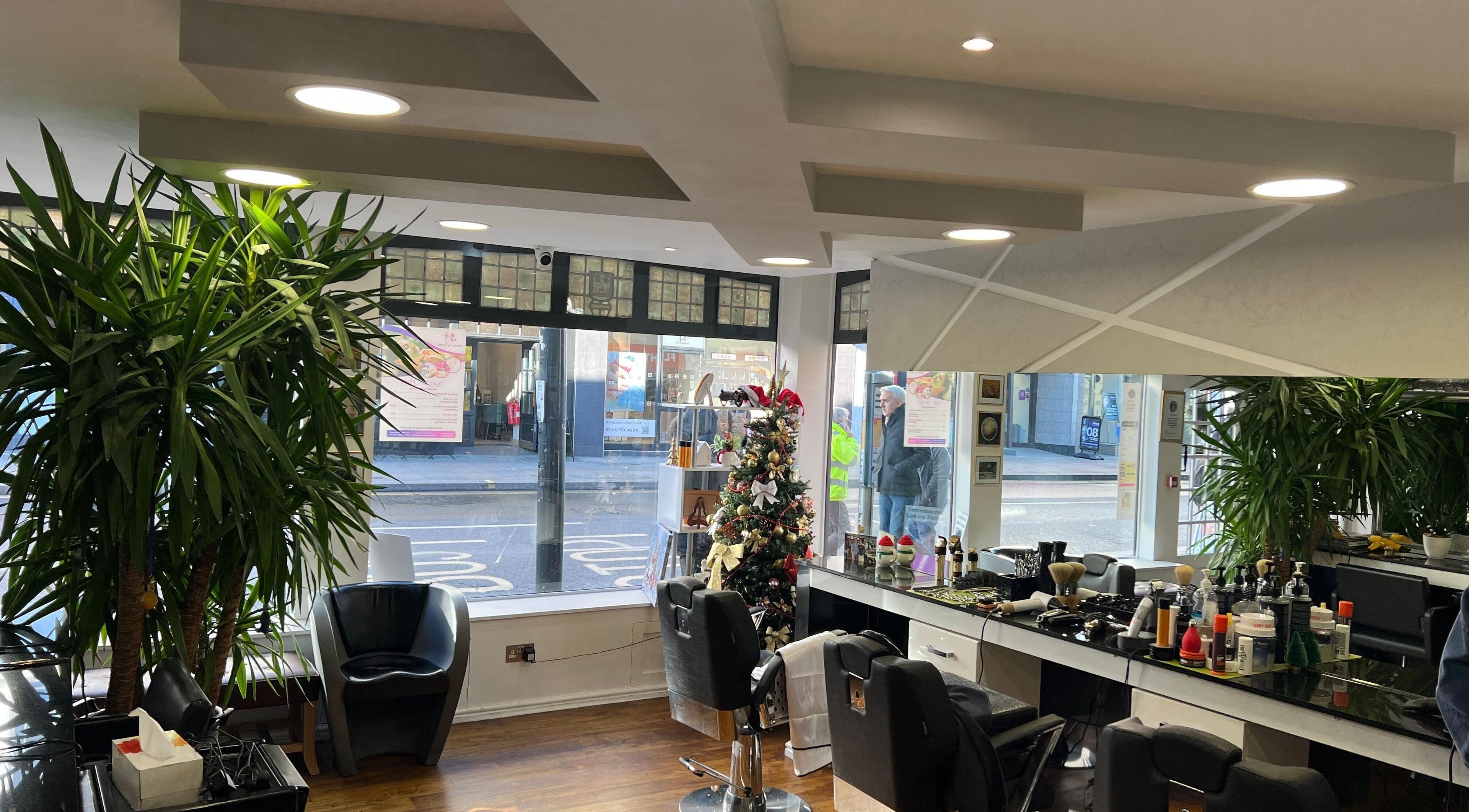 Chic salon interior at A&N London, Richmond, England, GB showcasing stylish decor and service stations.