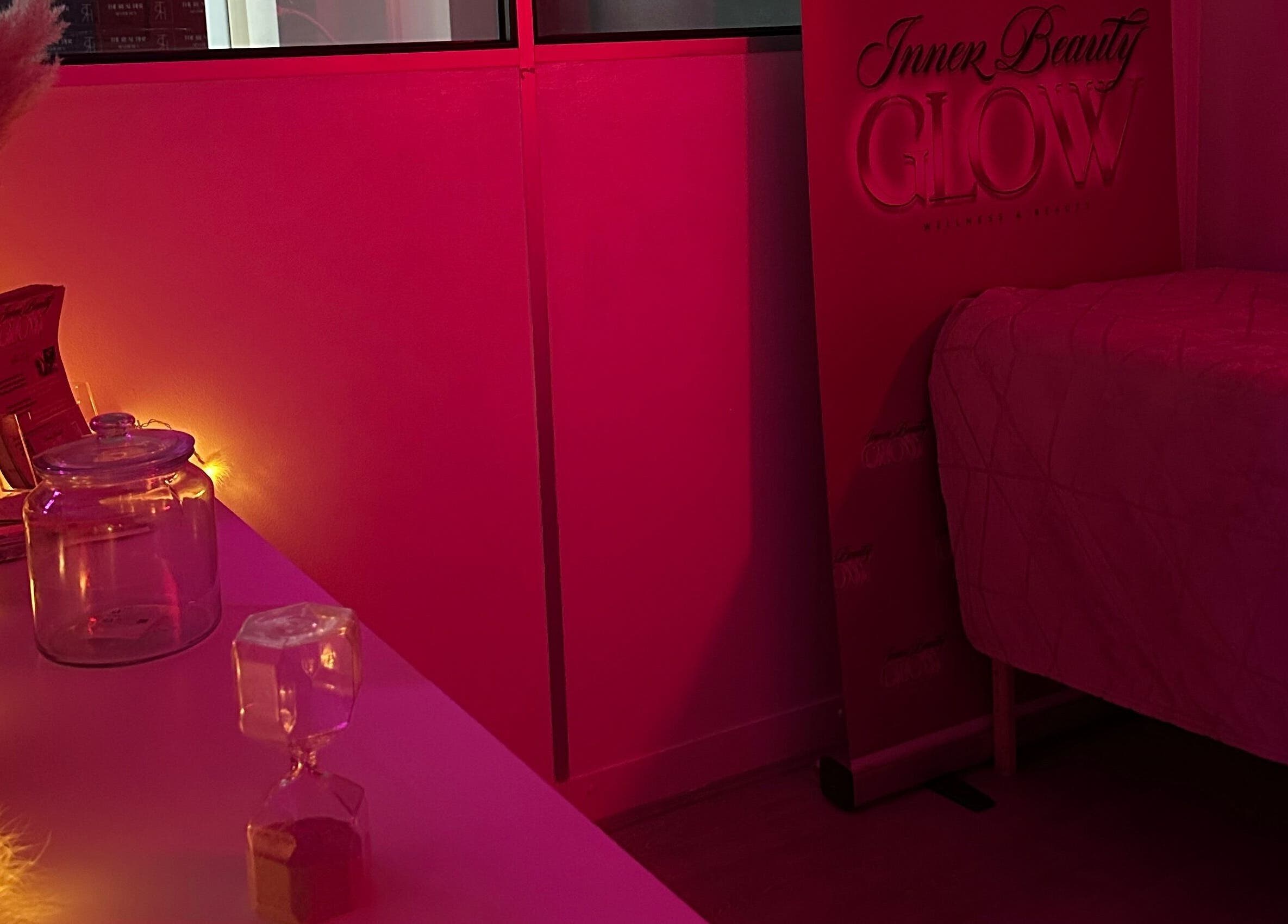 Cozy, dim-lit wellness room at Inner Beauty Glow, London, England, GB with ambient lighting and tranquil decor.