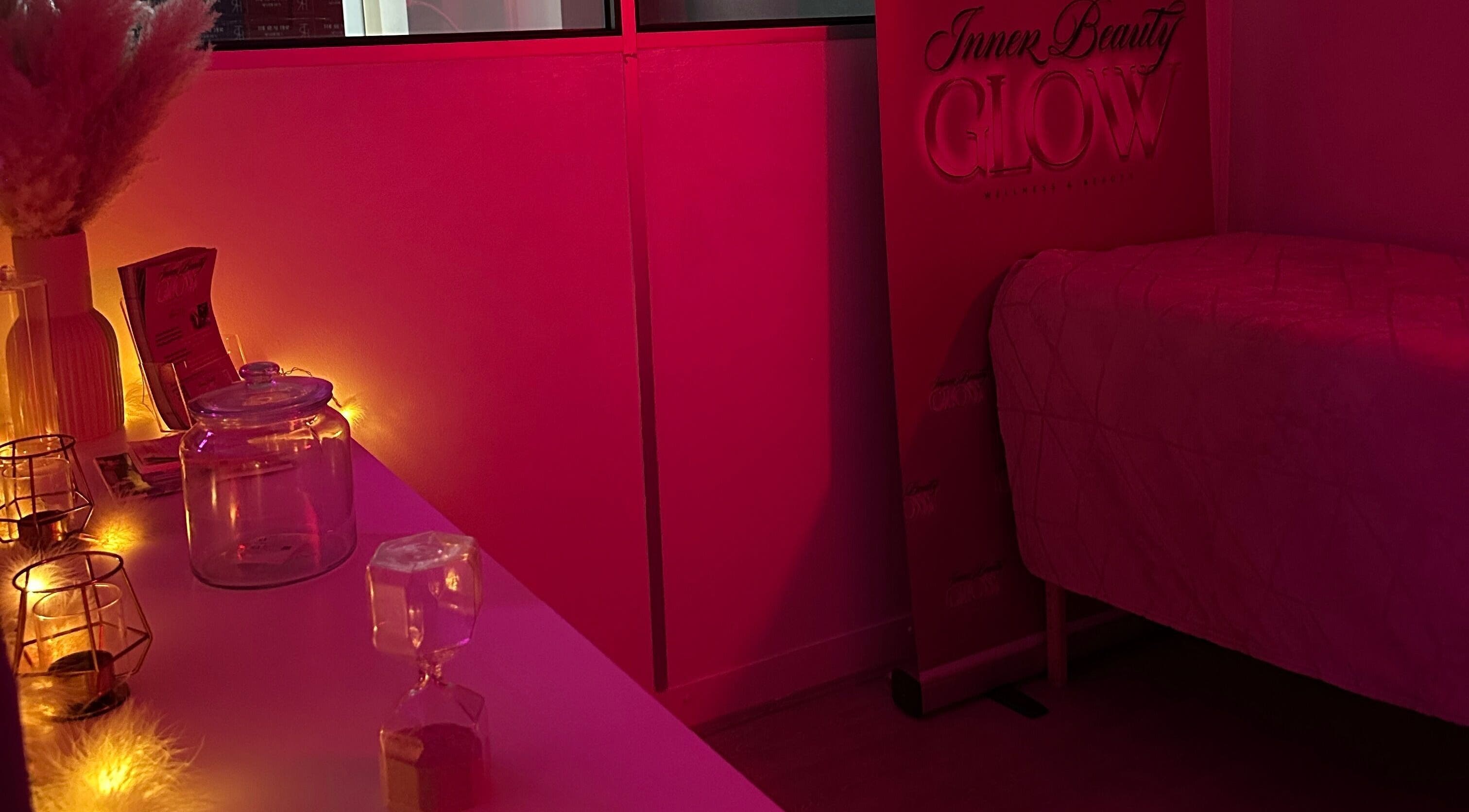 Cozy, dim-lit wellness room at Inner Beauty Glow, London, England, GB with ambient lighting and tranquil decor.