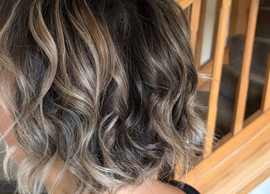 Stylish curly hairstyle at Hair by Sienna in Northowram, England, GB, showcasing textured layers.