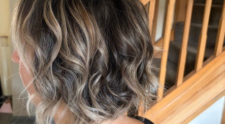 Stylish curly hairstyle at Hair by Sienna in Northowram, England, GB, showcasing textured layers.