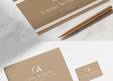 Glam Aesthetic Studio business cards and pen on marble surface, London, England, GB.