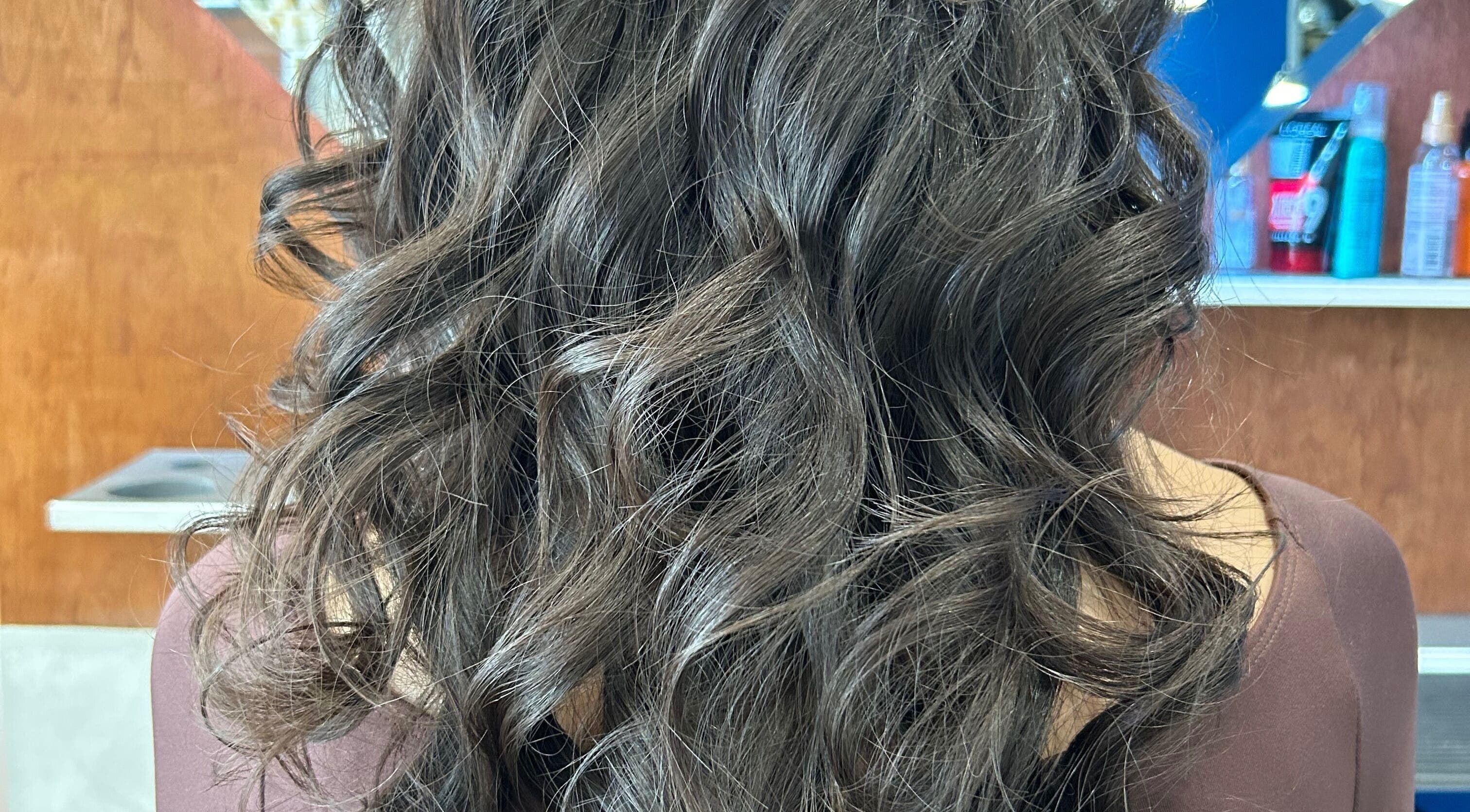 Elegant brunette curls styled at HairPrecisionByDaniela in London, England, GB, showcasing salon expertise.