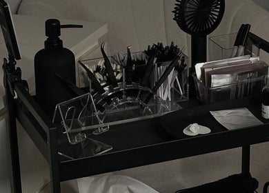 Lash tools and products on a cart at Lina Lash Studio in Huissen, Gelderland, NL, showcasing professional setup.