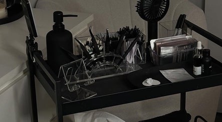 Lash tools and products on a cart at Lina Lash Studio in Huissen, Gelderland, NL, showcasing professional setup.