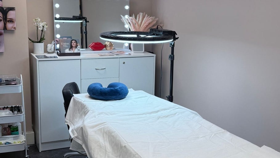 Modern spa treatment room at London Skin Therapy, Hounslow, England, GB showcasing calming decor and amenities.