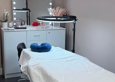 Modern spa treatment room at London Skin Therapy, Hounslow, England, GB showcasing calming decor and amenities.