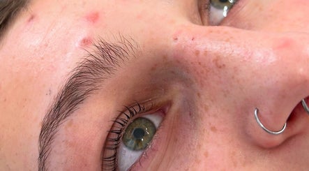 Close-up of a client's eye at Bliss Beauty by Chloe, Willenhall, England, showcasing clear skin and a nose piercing.