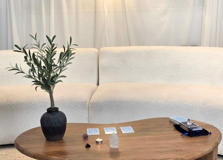 Elegant lounge at Jessica Vella-Templeton, Falmouth, England, GB with cream sofas and wooden table.