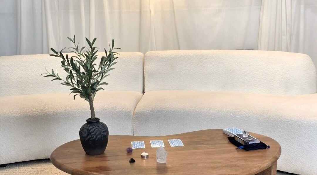 Elegant lounge at Jessica Vella-Templeton, Falmouth, England, GB with cream sofas and wooden table.