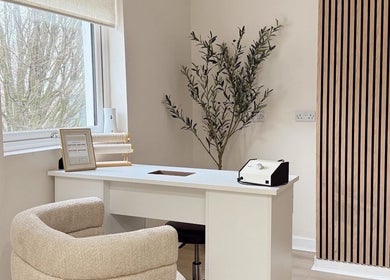Modern spa corner at Mish Beauty, Stoke-on-Trent, England, GB featuring elegant desk and seating.
