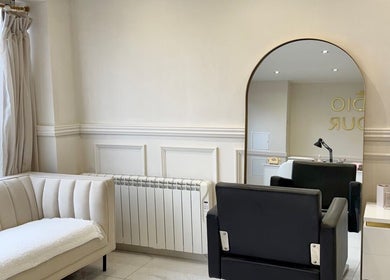 Chic interior of Mish Beauty, Stoke-on-Trent, England, GB, featuring stylish seating and modern decor.