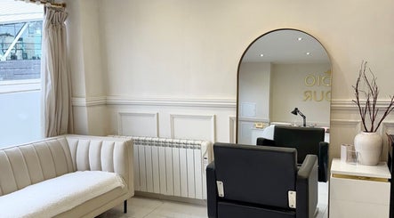 Chic interior of Mish Beauty, Stoke-on-Trent, England, GB, featuring stylish seating and modern decor.