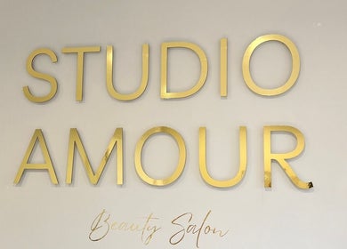Gold lettering wall sign reads Studio Amour Beauty Salon at Mish Beauty in Stoke-on-Trent, England, GB.