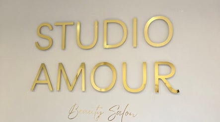 Gold lettering wall sign reads Studio Amour Beauty Salon at Mish Beauty in Stoke-on-Trent, England, GB.